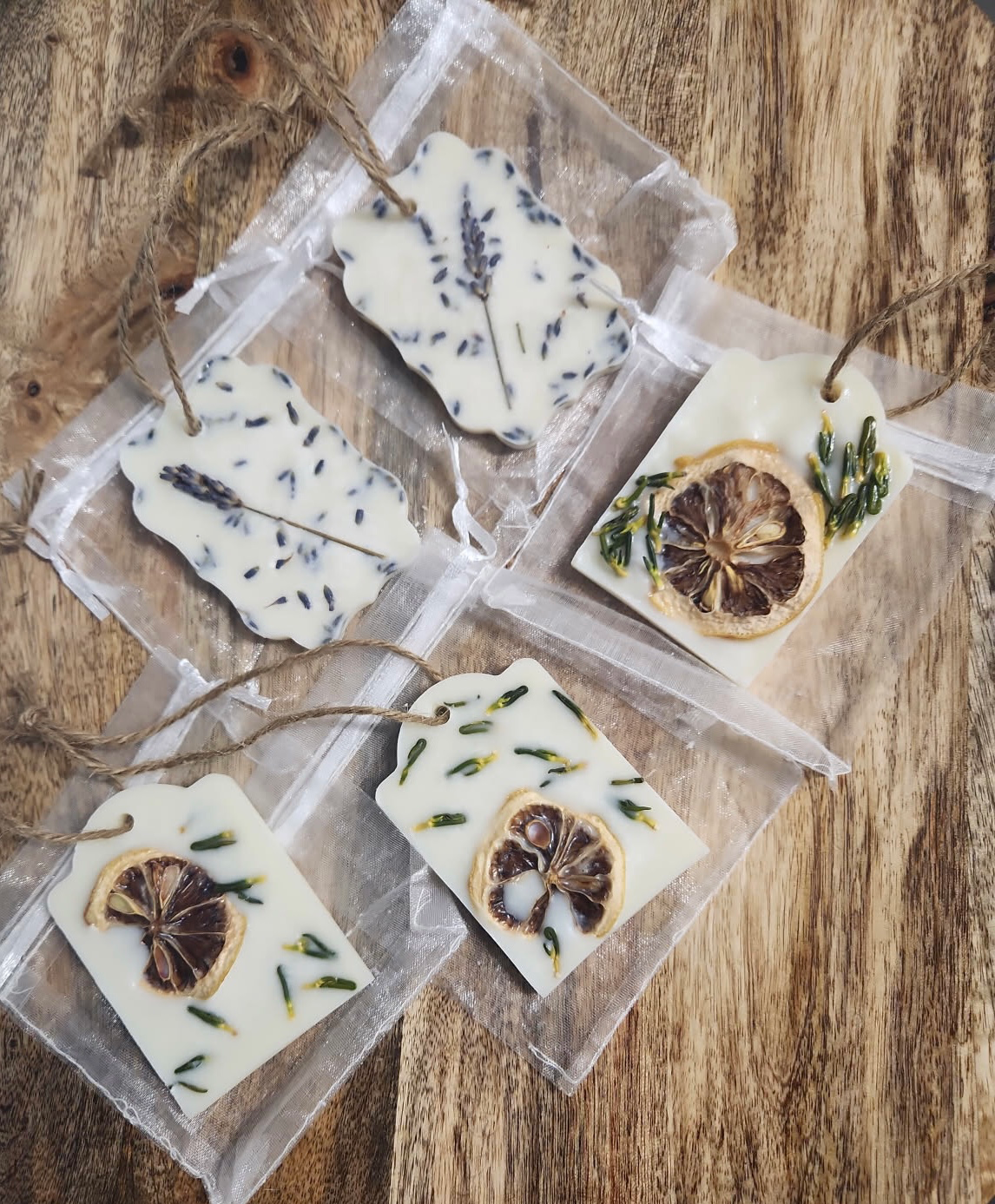 Decorative wax melts with lemon and lavender on a wooden surface