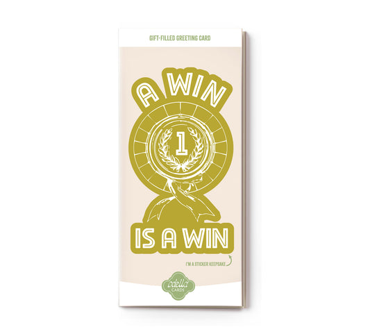 Greeting card with 'A win is a win' design on a beige background